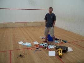 Joe putting together the shot for the cover for Ishmael and the Return of the Dugongs on a local squash court.
